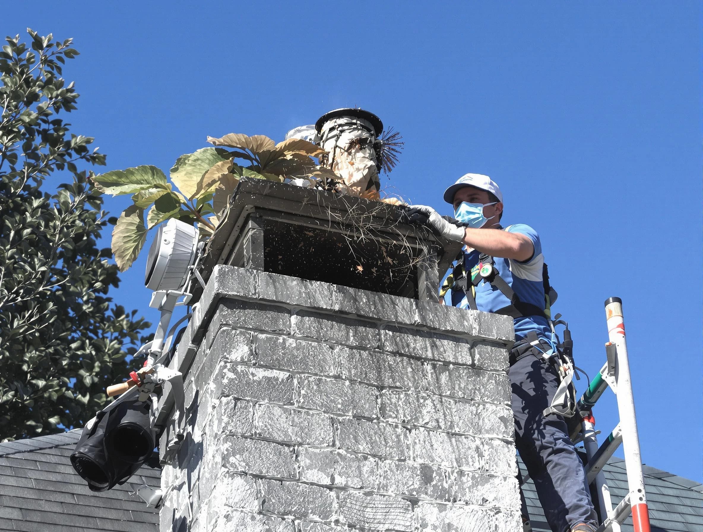 Long Branch Chimney Sweep specialist performing chimney cleaning in Long Branch, NJ