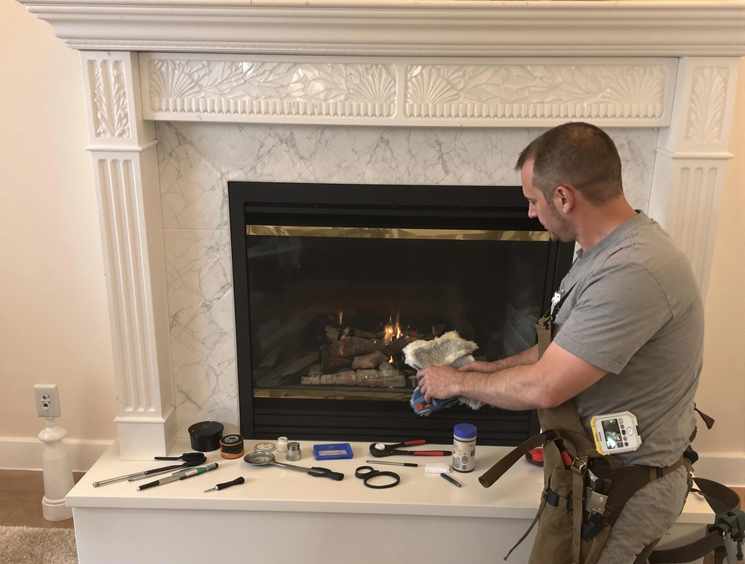 Long Branch Chimney Sweep performing fireplace maintenance in Long Branch, NJ